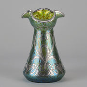 Silvered Papillon Vase by Loetz Witwe Art Nouveau tourquoise papillon glass vase, decorated with an applied silver floral organic pattern that wraps around the circumference of the body