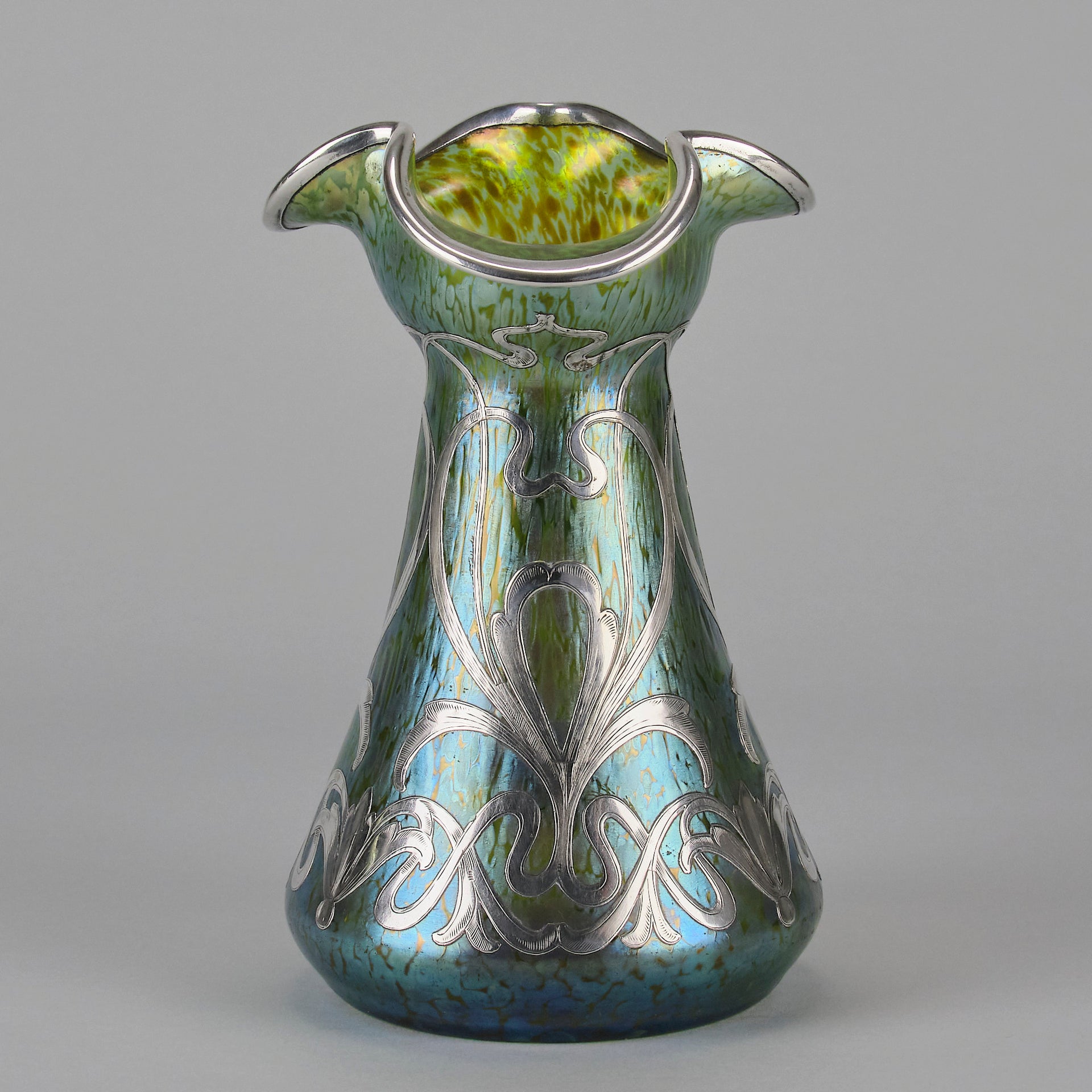 Silvered Papillon Vase by Loetz Witwe Art Nouveau tourquoise papillon glass vase, decorated with an applied silver floral organic pattern that wraps around the circumference of the body