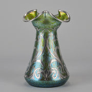 Silvered Papillon Vase by Loetz Witwe Art Nouveau tourquoise papillon glass vase, decorated with an applied silver floral organic pattern that wraps around the circumference of the body