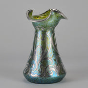 Silvered Papillon Vase by Loetz Witwe Art Nouveau tourquoise papillon glass vase, decorated with an applied silver floral organic pattern that wraps around the circumference of the body