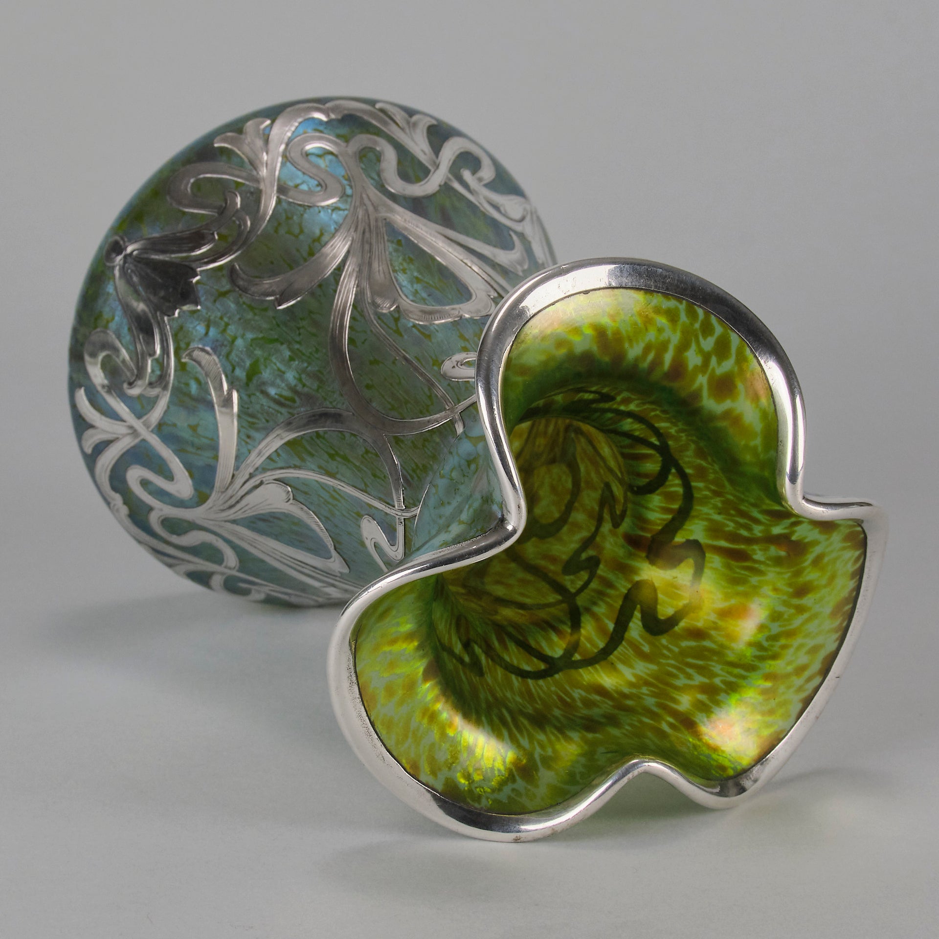 Silvered Papillon Vase by Loetz Witwe Art Nouveau tourquoise papillon glass vase, decorated with an applied silver floral organic pattern that wraps around the circumference of the body