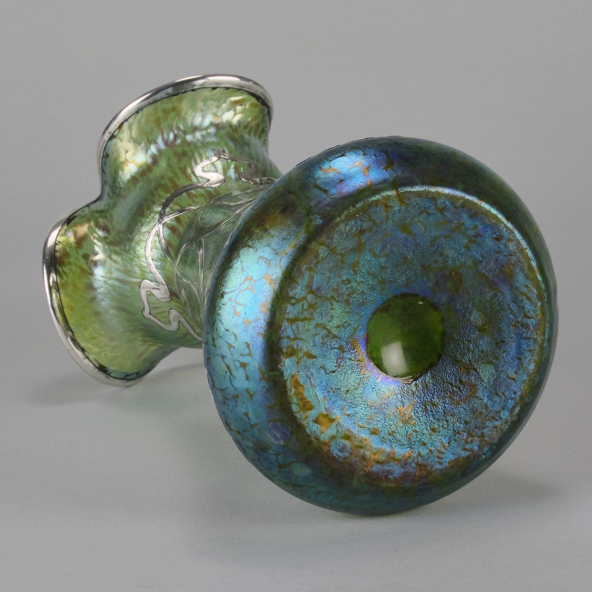 Silvered Papillon Vase by Loetz Witwe Art Nouveau tourquoise papillon glass vase, decorated with an applied silver floral organic pattern that wraps around the circumference of the body