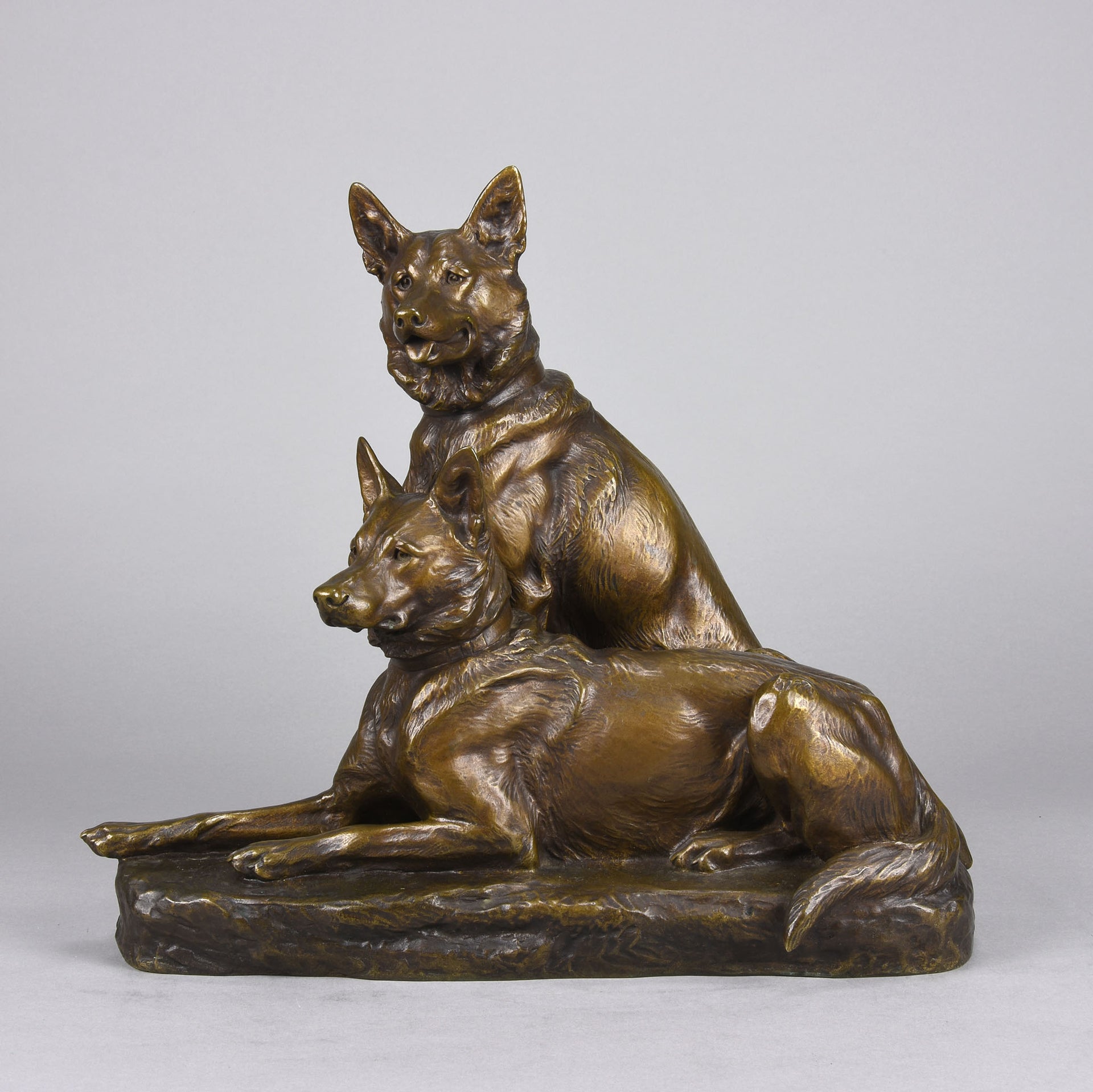Two Alsatians by Louis Riché  gilt bronze group of two Alsatians, one seated in alert pose with its head turned slightly and ears pricked whilst the other one lays in an alert pose
