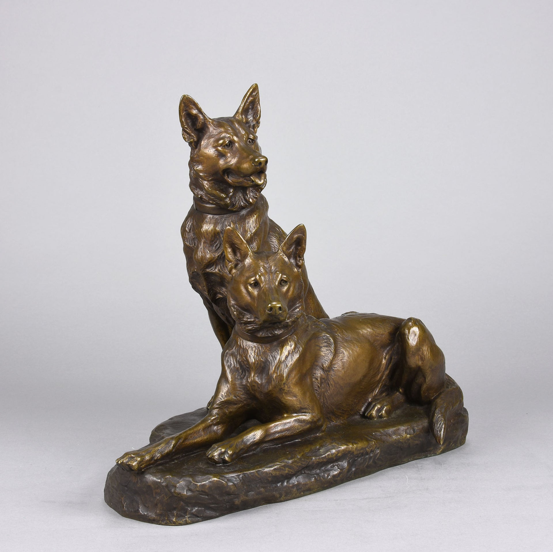 Two Alsatians by Louis Riché  gilt bronze group of two Alsatians, one seated in alert pose with its head turned slightly and ears pricked whilst the other one lays in an alert pose