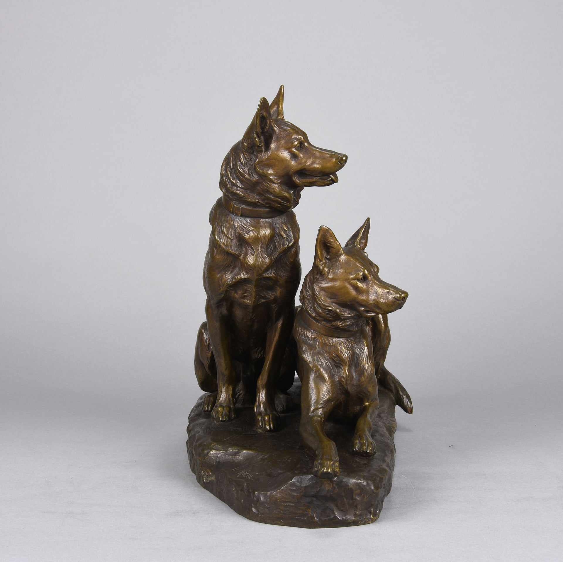 Two Alsatians by Louis Riché  gilt bronze group of two Alsatians, one seated in alert pose with its head turned slightly and ears pricked whilst the other one lays in an alert pose
