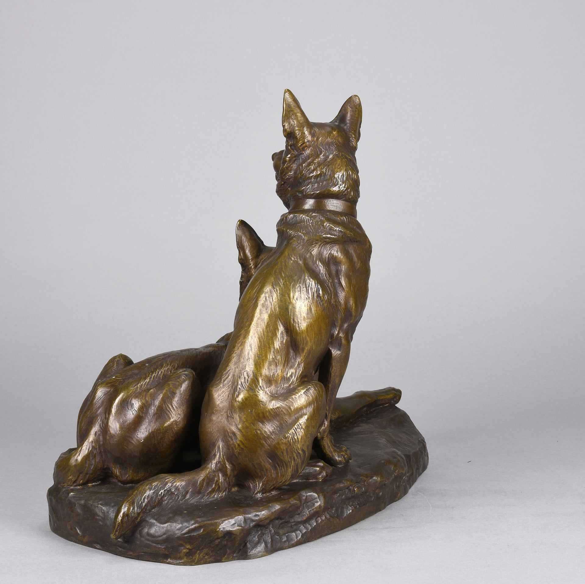 Two Alsatians by Louis Riché  gilt bronze group of two Alsatians, one seated in alert pose with its head turned slightly and ears pricked whilst the other one lays in an alert pose