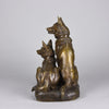 Two Alsatians by Louis Riché  gilt bronze group of two Alsatians, one seated in alert pose with its head turned slightly and ears pricked whilst the other one lays in an alert pose