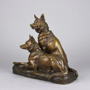 Two Alsatians by Louis Riché  gilt bronze group of two Alsatians, one seated in alert pose with its head turned slightly and ears pricked whilst the other one lays in an alert pose