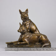 Two Alsatians by Louis Riché  gilt bronze group of two Alsatians, one seated in alert pose with its head turned slightly and ears pricked whilst the other one lays in an alert pose