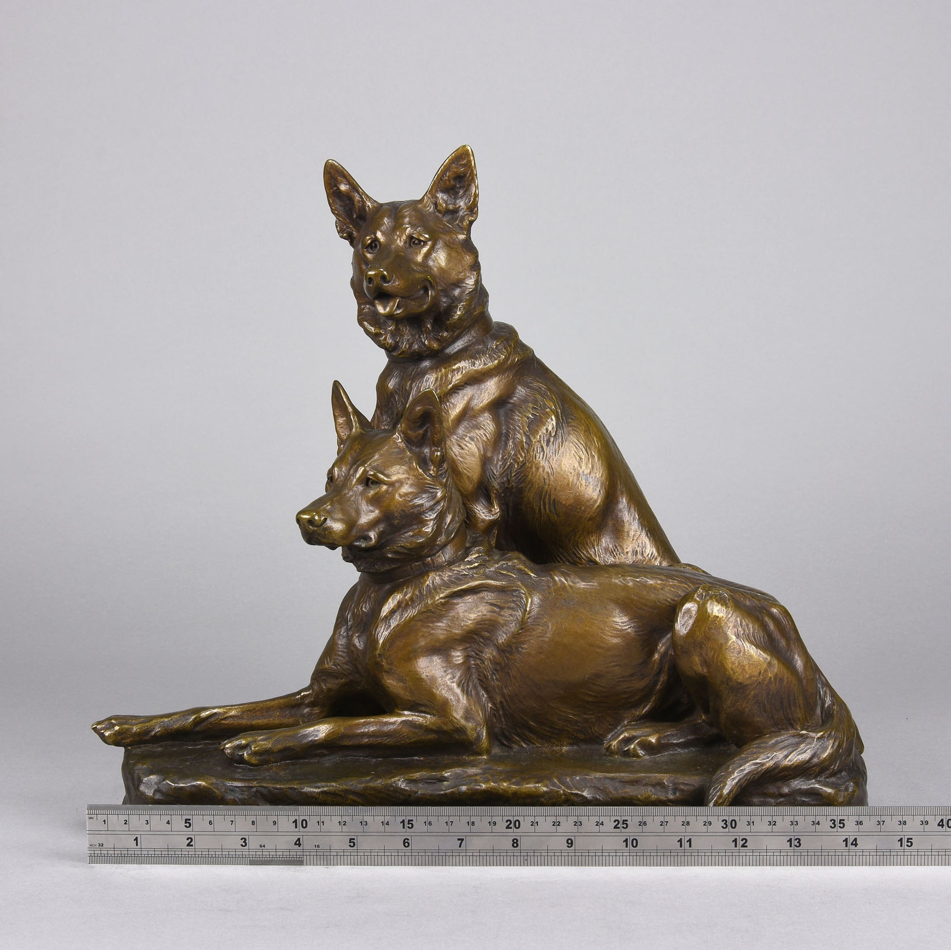 Two Alsatians by Louis Riché  gilt bronze group of two Alsatians, one seated in alert pose with its head turned slightly and ears pricked whilst the other one lays in an alert pose