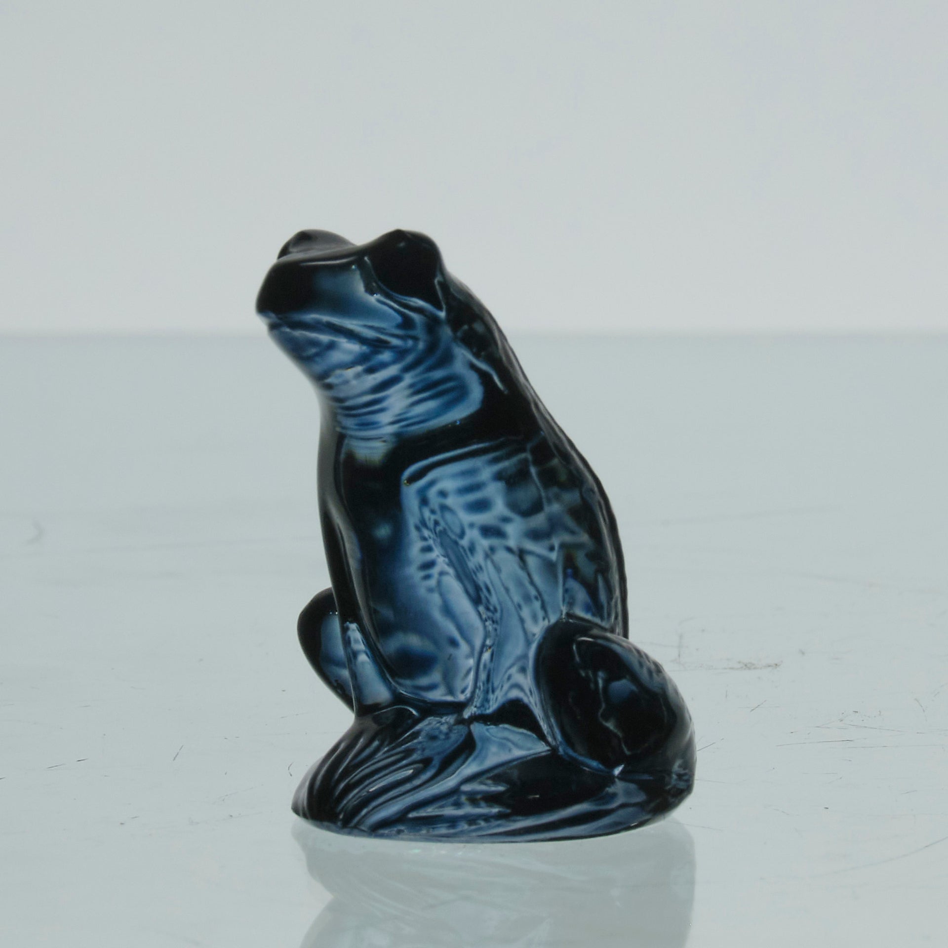 La Grenouille Bleu by Marc Lalique a charming mid 20th Century dark blue polished glass study of a seated frog with a charming look upon its face