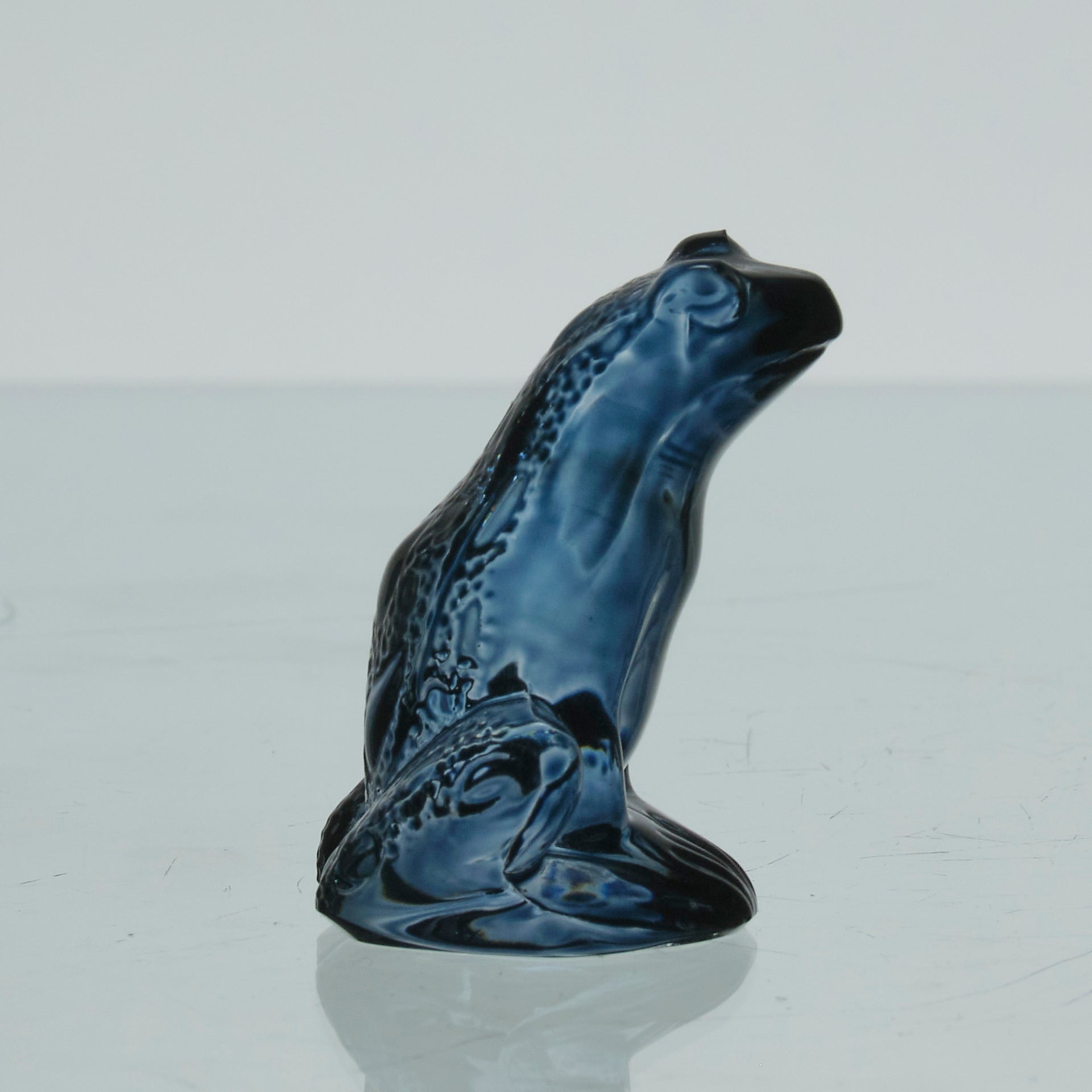 La Grenouille Bleu by Marc Lalique a charming mid 20th Century dark blue polished glass study of a seated frog with a charming look upon its face