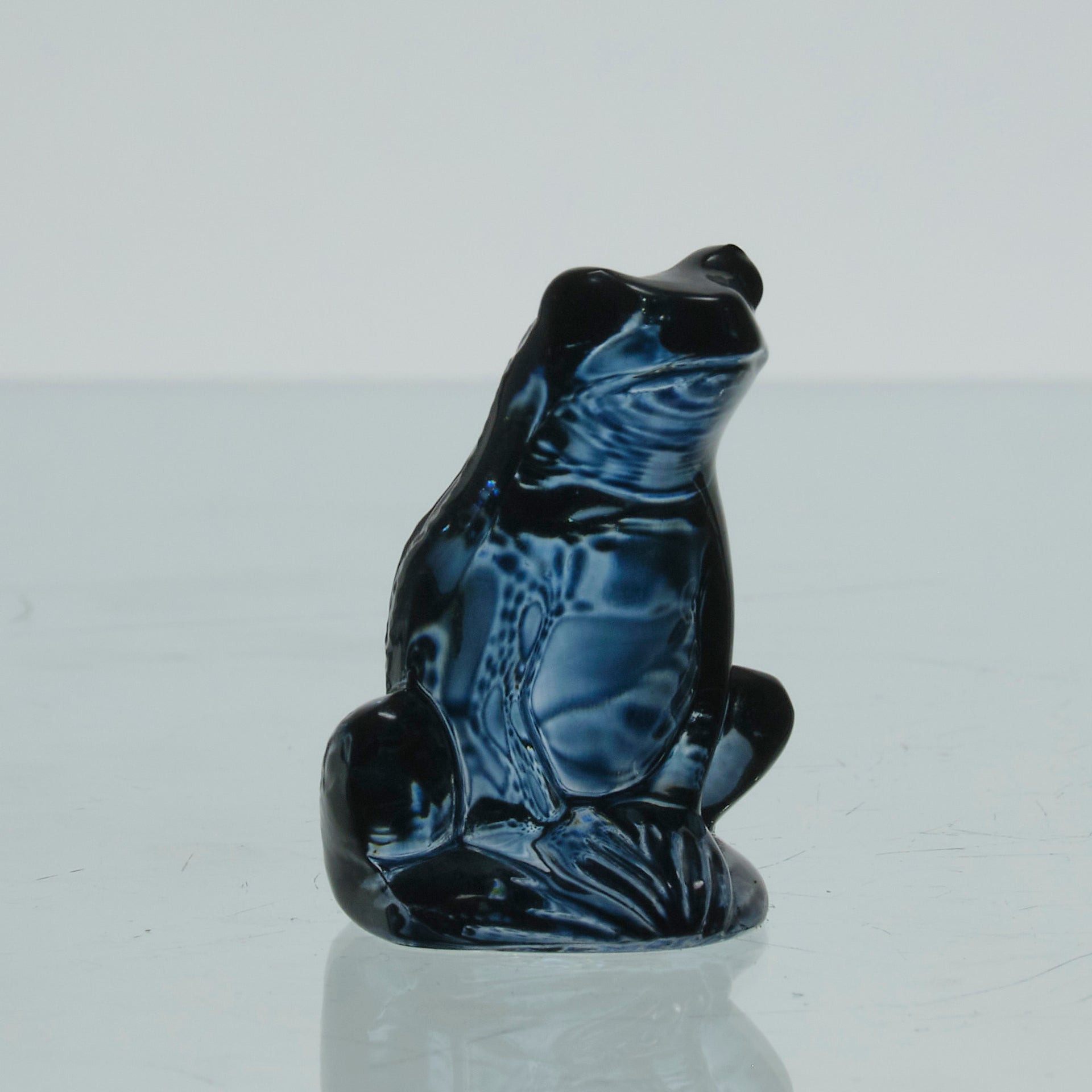 La Grenouille Bleu by Marc Lalique a charming mid 20th Century dark blue polished glass study of a seated frog with a charming look upon its face