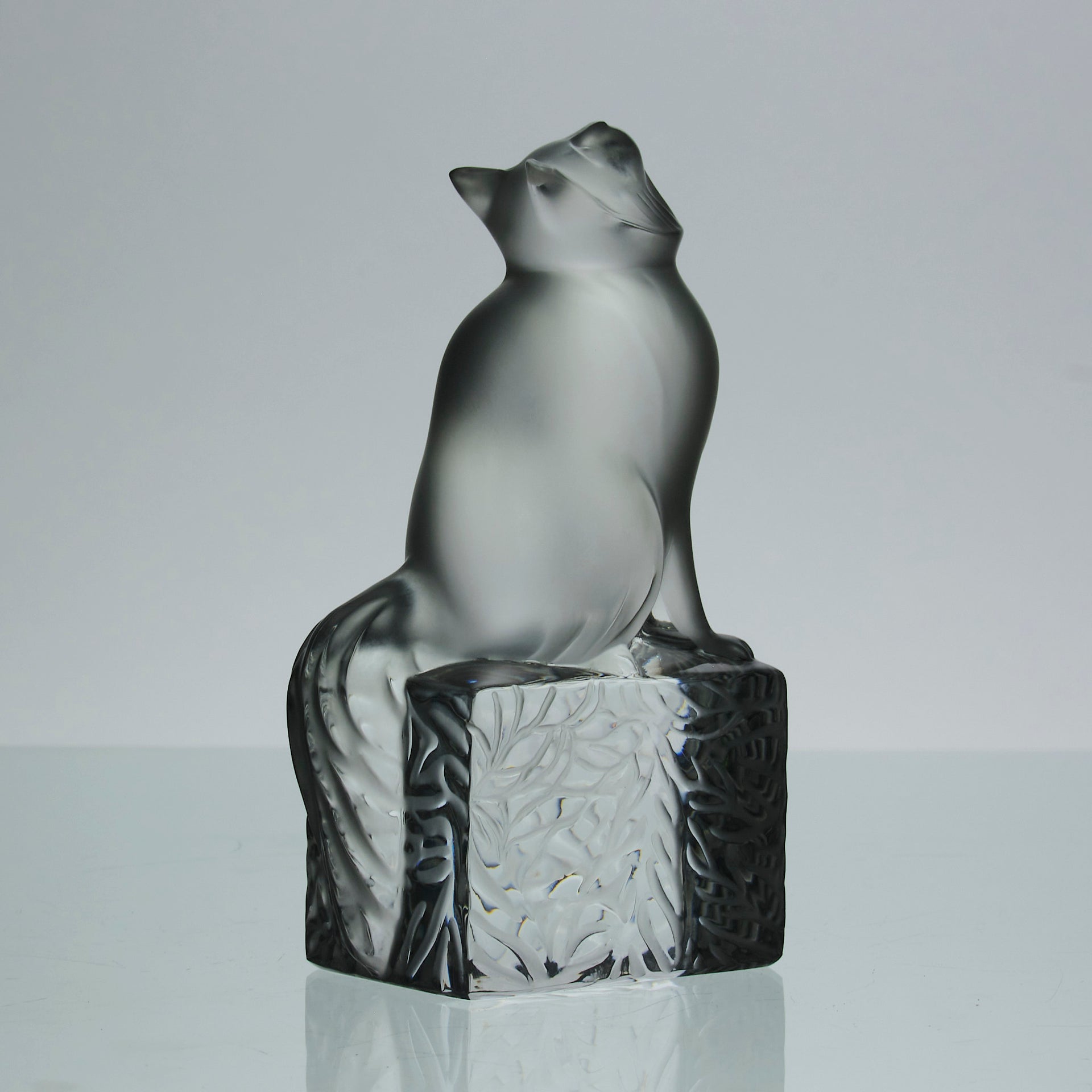 Chat Attente a charming frosted glass study of a seated cat with its head raised in a concentrated pose by Marc Lalique