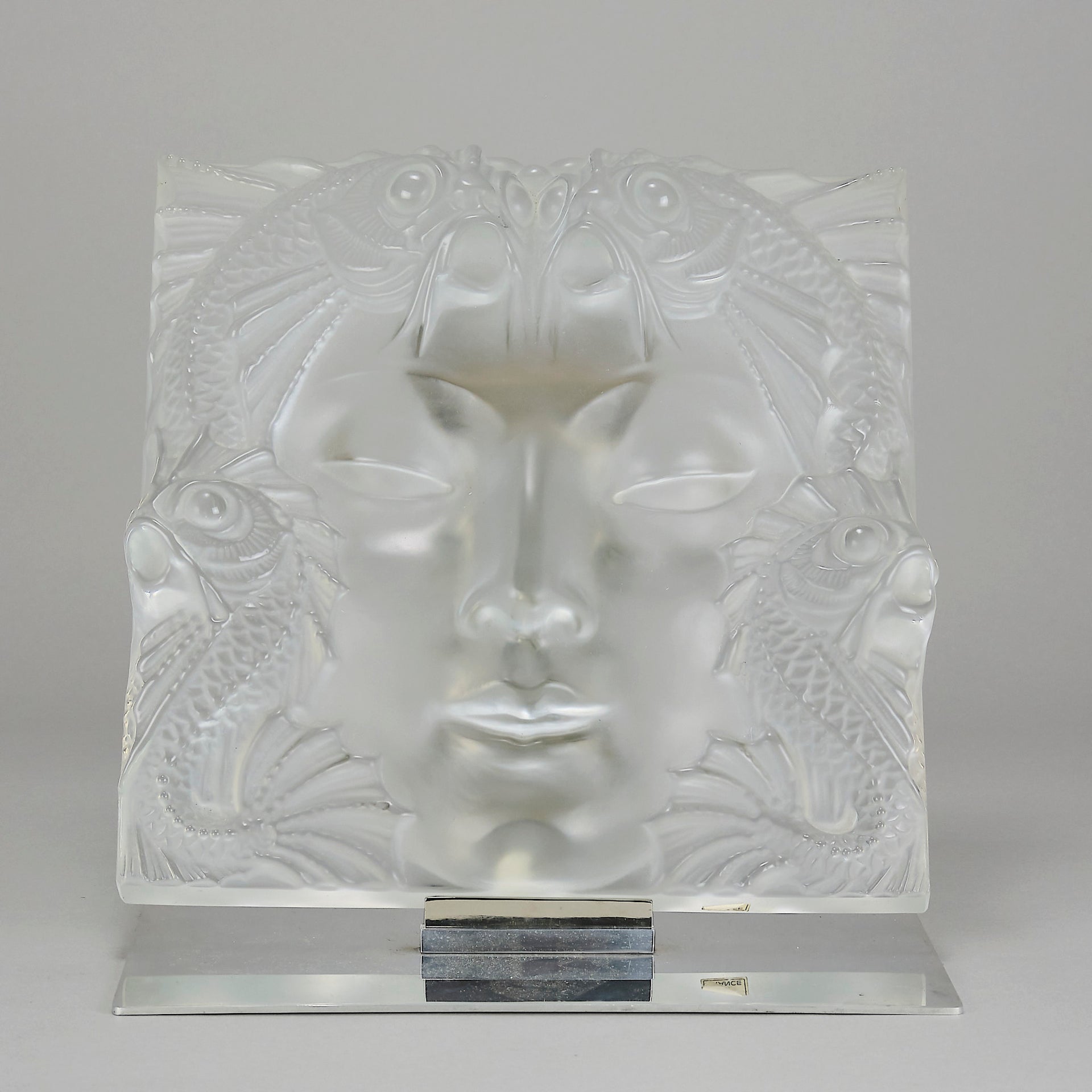 Masque De Femme by Marc Lalique An excellent mid 20th Century clear and frosted glass wall plaque decorated with a pretty Art Deco face framed with exotic fish