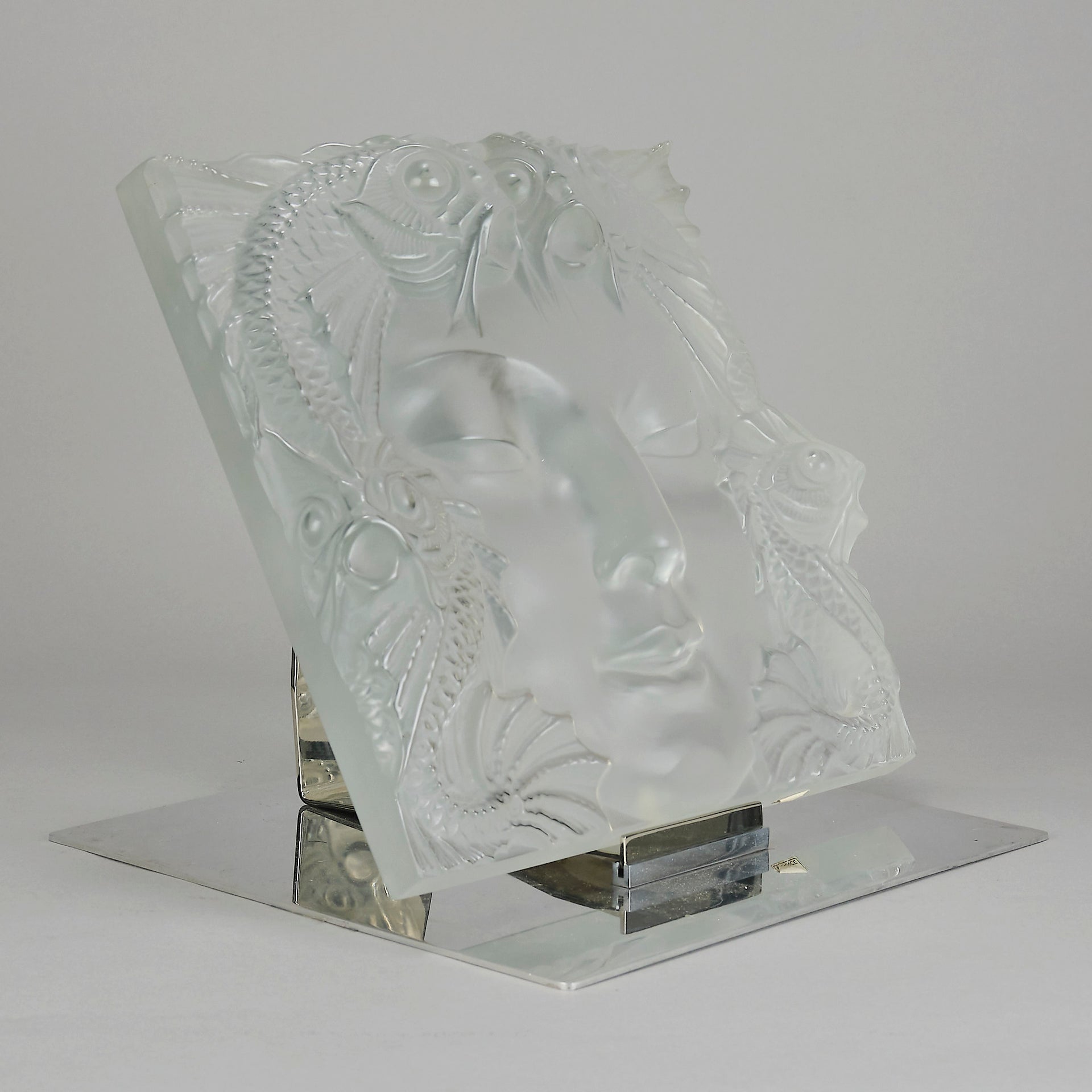 Masque De Femme by Marc Lalique An excellent mid 20th Century clear and frosted glass wall plaque decorated with a pretty Art Deco face framed with exotic fish