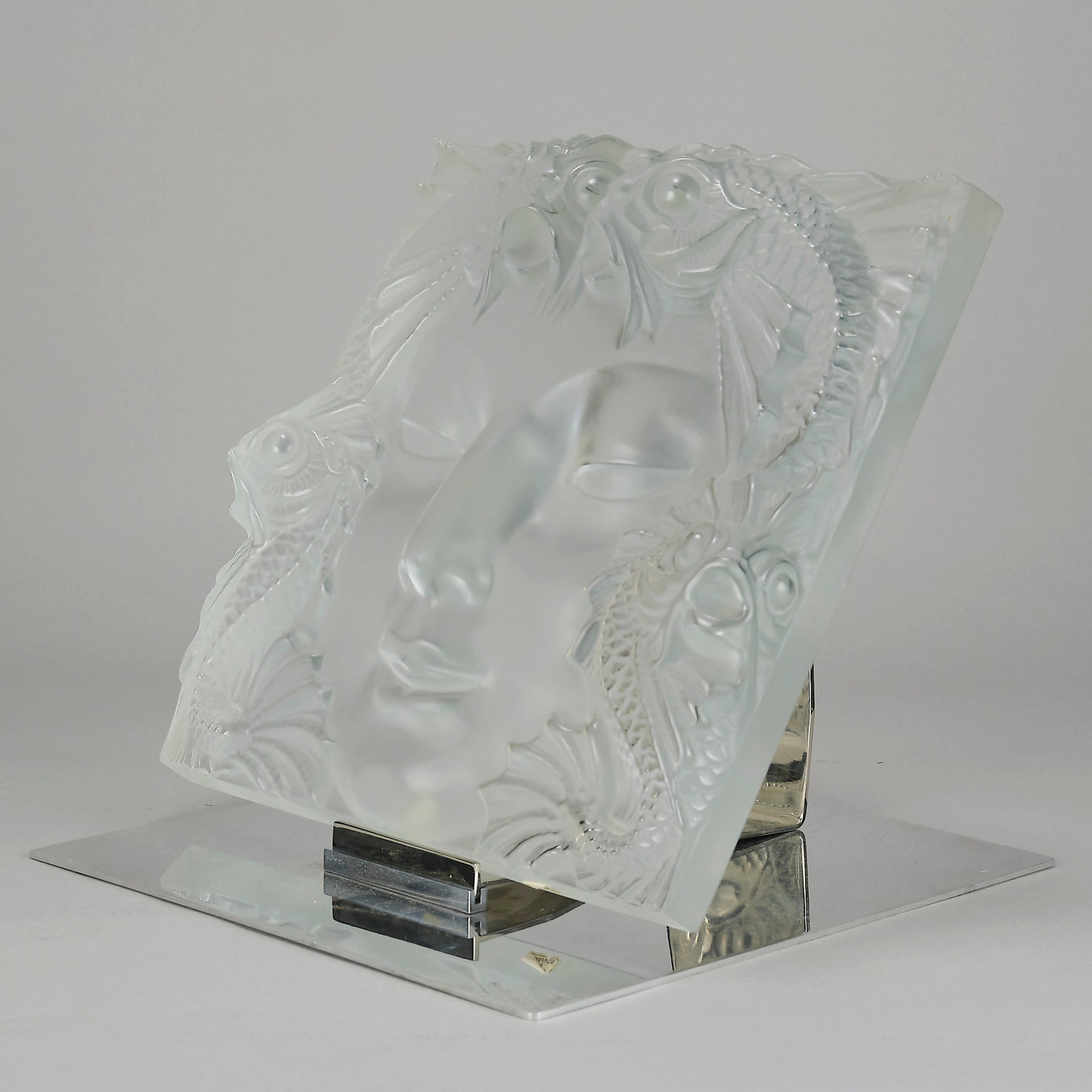 Masque De Femme by Marc Lalique An excellent mid 20th Century clear and frosted glass wall plaque decorated with a pretty Art Deco face framed with exotic fish