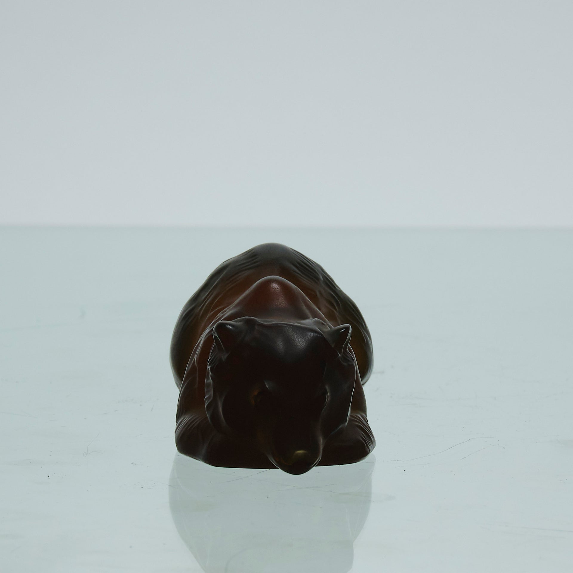 Ours Repose by Marc Lalique A sweet mid 20th Century frosted glass study of a resting bear, exhibiting excellent hand finished surface detail and rich deep amber colour