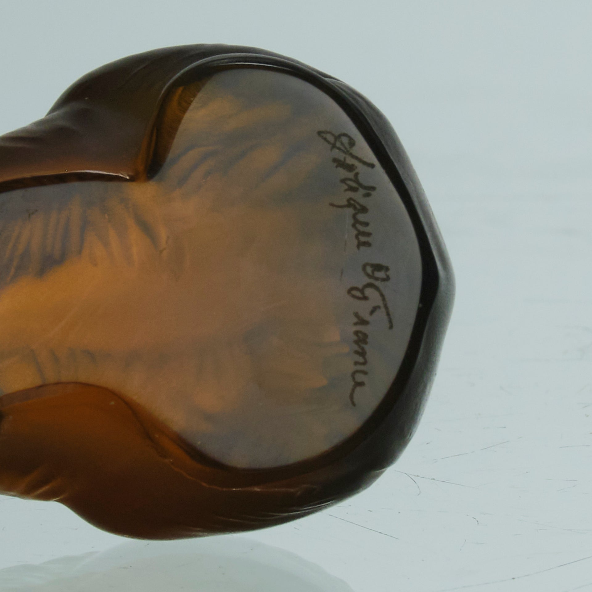 Ours Repose by Marc Lalique A sweet mid 20th Century frosted glass study of a resting bear, exhibiting excellent hand finished surface detail and rich deep amber colour