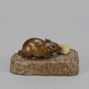 Antique Bronze Statue of a mouse nibbling some cheese depicted in cream marble. The bronze study exhibiting excellent hand chased surface detail and good colour, raised on a rough hewn granite base