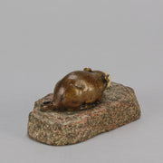Antique Bronze Statue of a mouse nibbling some cheese depicted in cream marble. The bronze study exhibiting excellent hand chased surface detail and good colour, raised on a rough hewn granite base