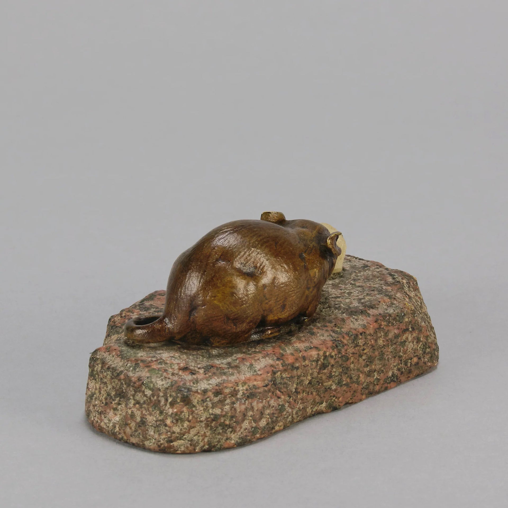 Antique Bronze Statue of a mouse nibbling some cheese depicted in cream marble. The bronze study exhibiting excellent hand chased surface detail and good colour, raised on a rough hewn granite base