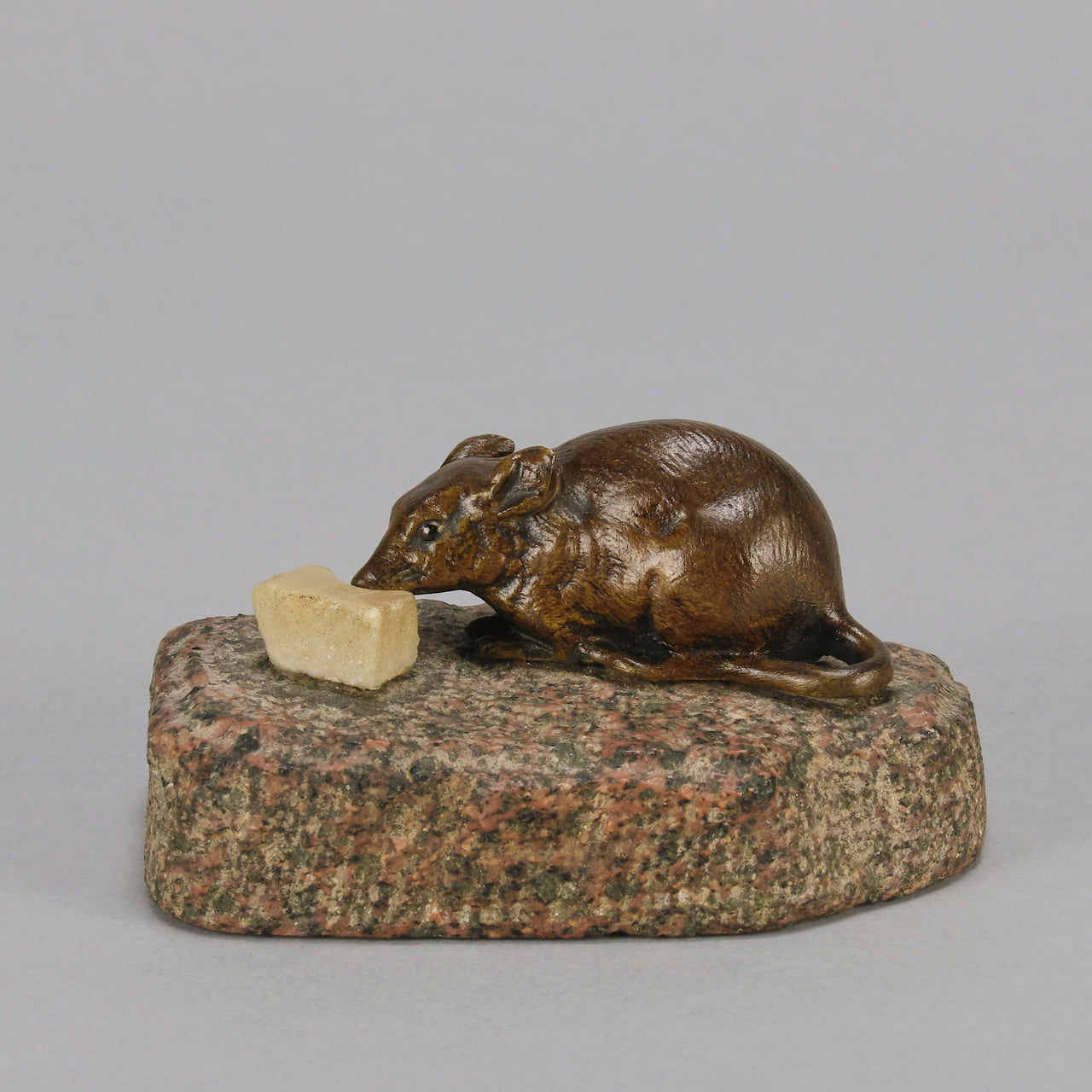 Antique Bronze Statue of a mouse nibbling some cheese depicted in cream marble. The bronze study exhibiting excellent hand chased surface detail and good colour, raised on a rough hewn granite base