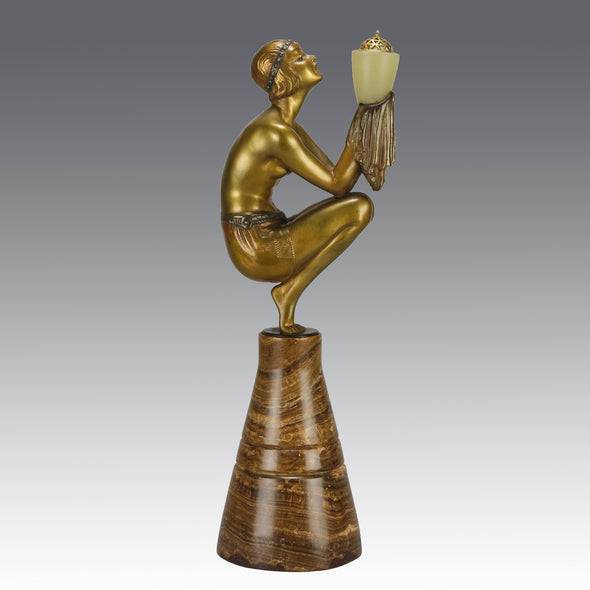 Oblivion by Georges Ducernet - Art Deco Statue 1930s a cold painted bronze figure of a dancer in a crouched pose holding a lidded urn. Exhibiting excellent colour and detail, raised on a conical marble plinth 