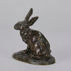 Lapin au Repos Antique bronze statue of a seated rabbit with excellent hand chased surface detail and very fine rich dark brown and golden patina. Raised on naturalistic base 