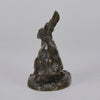 Lapin au Repos Antique bronze statue of a seated rabbit with excellent hand chased surface detail and very fine rich dark brown and golden patina. Raised on naturalistic base 