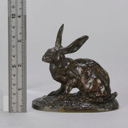 Lapin au Repos Antique bronze statue of a seated rabbit with excellent hand chased surface detail and very fine rich dark brown and golden patina. Raised on naturalistic base 