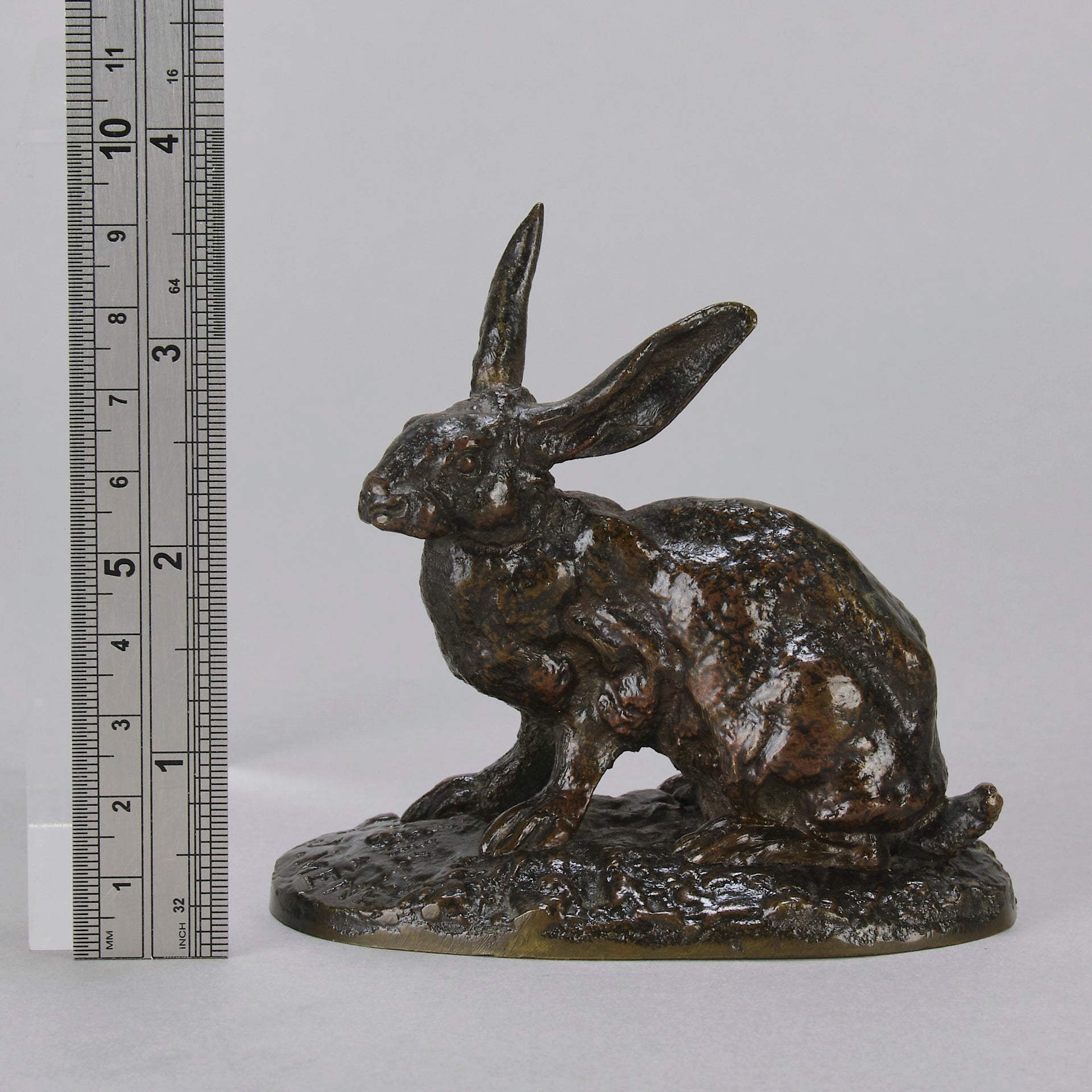 Lapin au Repos Antique bronze statue of a seated rabbit with excellent hand chased surface detail and very fine rich dark brown and golden patina. Raised on naturalistic base 