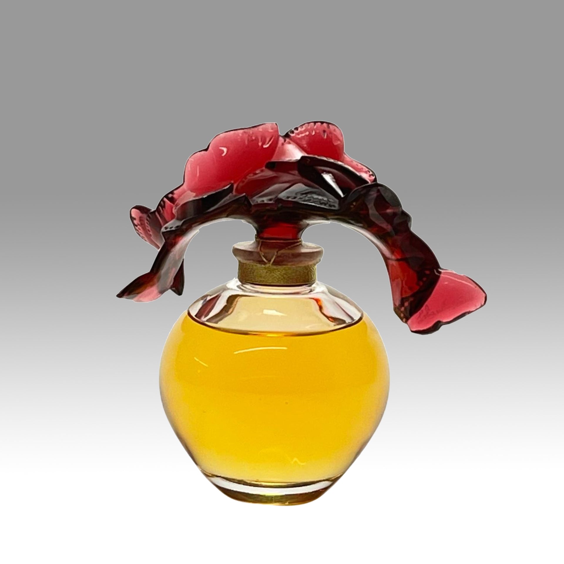Envol Perfume Bottle by Marie Claude Lalique A stunning limited edition clear and coloured glass scent bottle, the clear glass body containing the original Lalique perfume complete with a deep red glass stopper in the form of entwined butterflies - Hickmet Fine Arts