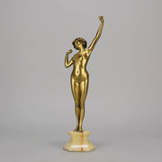 Art Deco Sculpture Le Reveil by Paul Philippe painted gilt and enamel bronze a attractive young woman as she stretches in the morning, raised on a shaped marble base