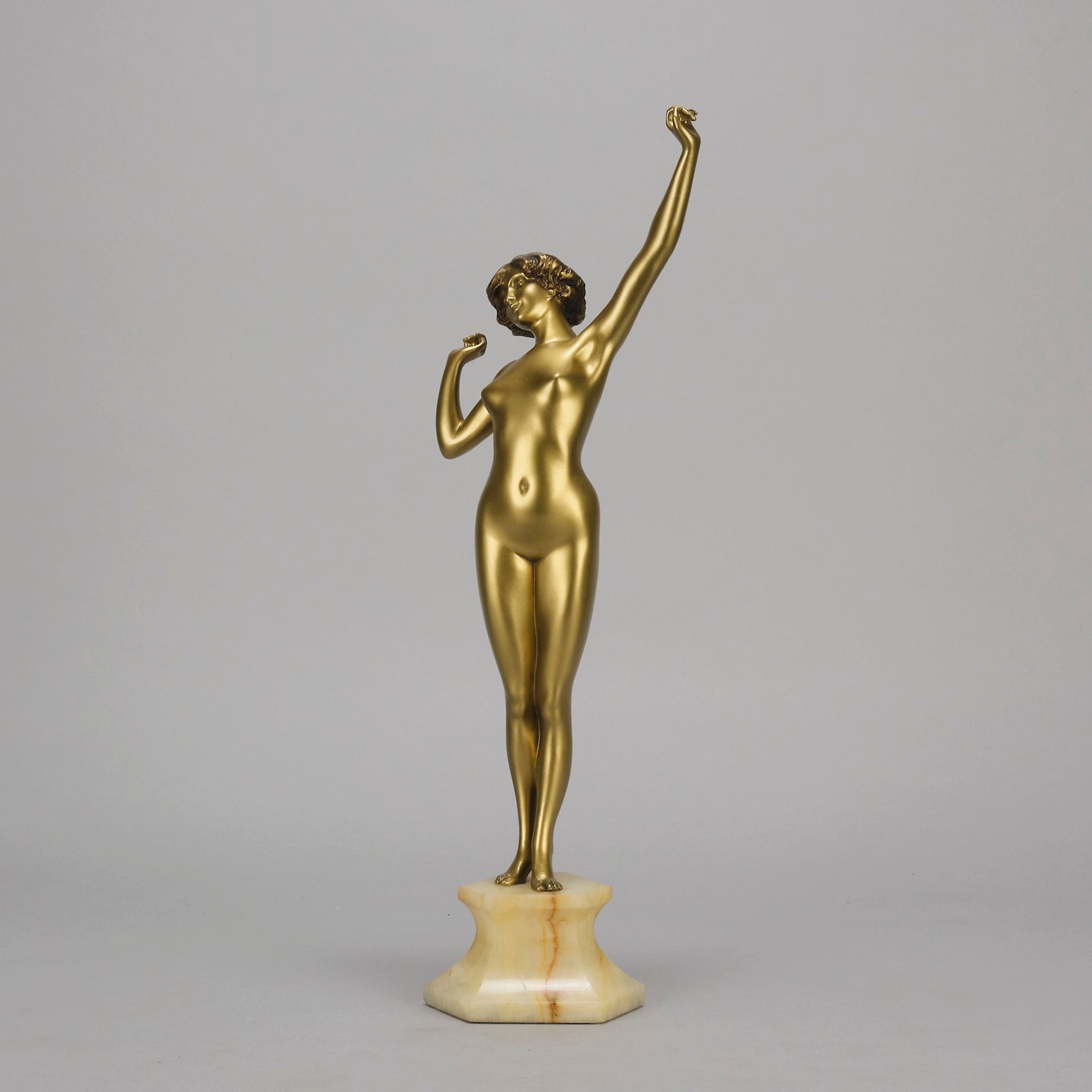 Art Deco Sculpture Le Reveil by Paul Philippe painted gilt and enamel bronze a attractive young woman as she stretches in the morning, raised on a shaped marble base