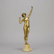 Art Deco Sculpture Le Reveil by Paul Philippe painted gilt and enamel bronze a attractive young woman as she stretches in the morning, raised on a shaped marble base