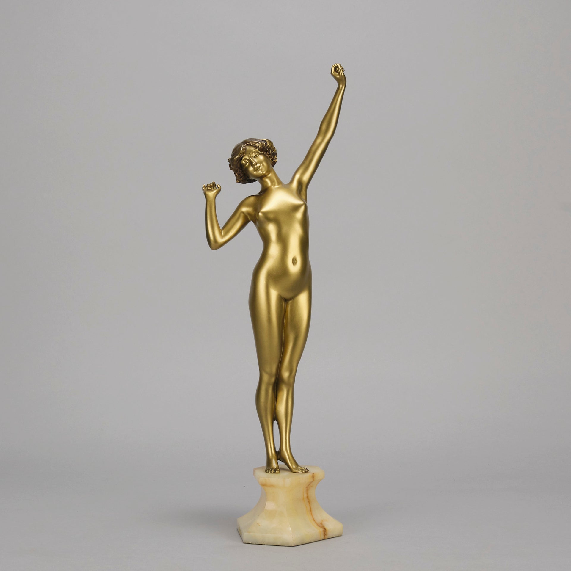 Art Deco Sculpture Le Reveil by Paul Philippe painted gilt and enamel bronze a attractive young woman as she stretches in the morning, raised on a shaped marble base