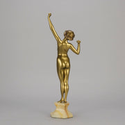 Art Deco Sculpture Le Reveil by Paul Philippe painted gilt and enamel bronze a attractive young woman as she stretches in the morning, raised on a shaped marble base