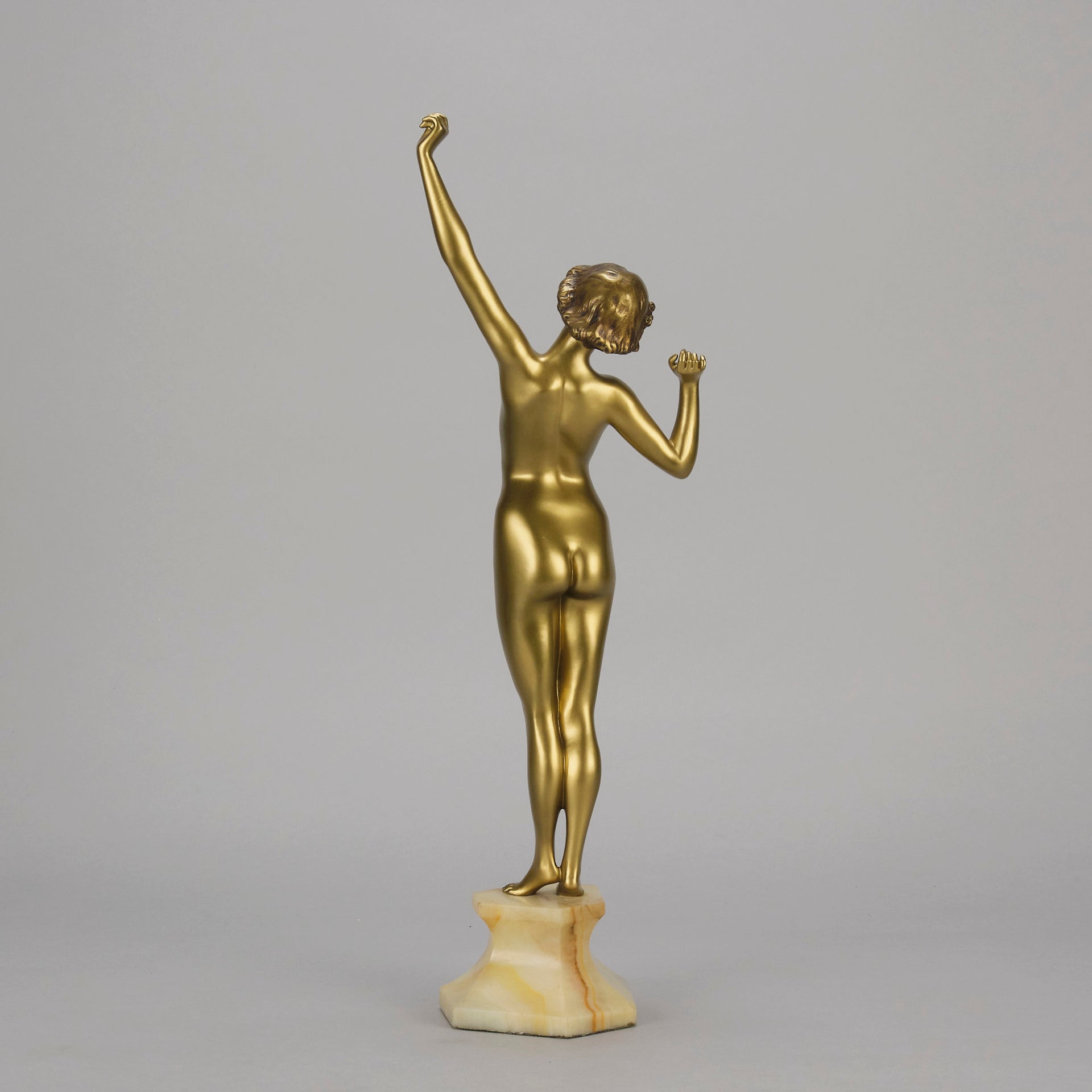 Art Deco Sculpture Le Reveil by Paul Philippe painted gilt and enamel bronze a attractive young woman as she stretches in the morning, raised on a shaped marble base