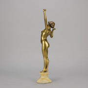 Art Deco Sculpture Le Reveil by Paul Philippe painted gilt and enamel bronze a attractive young woman as she stretches in the morning, raised on a shaped marble base