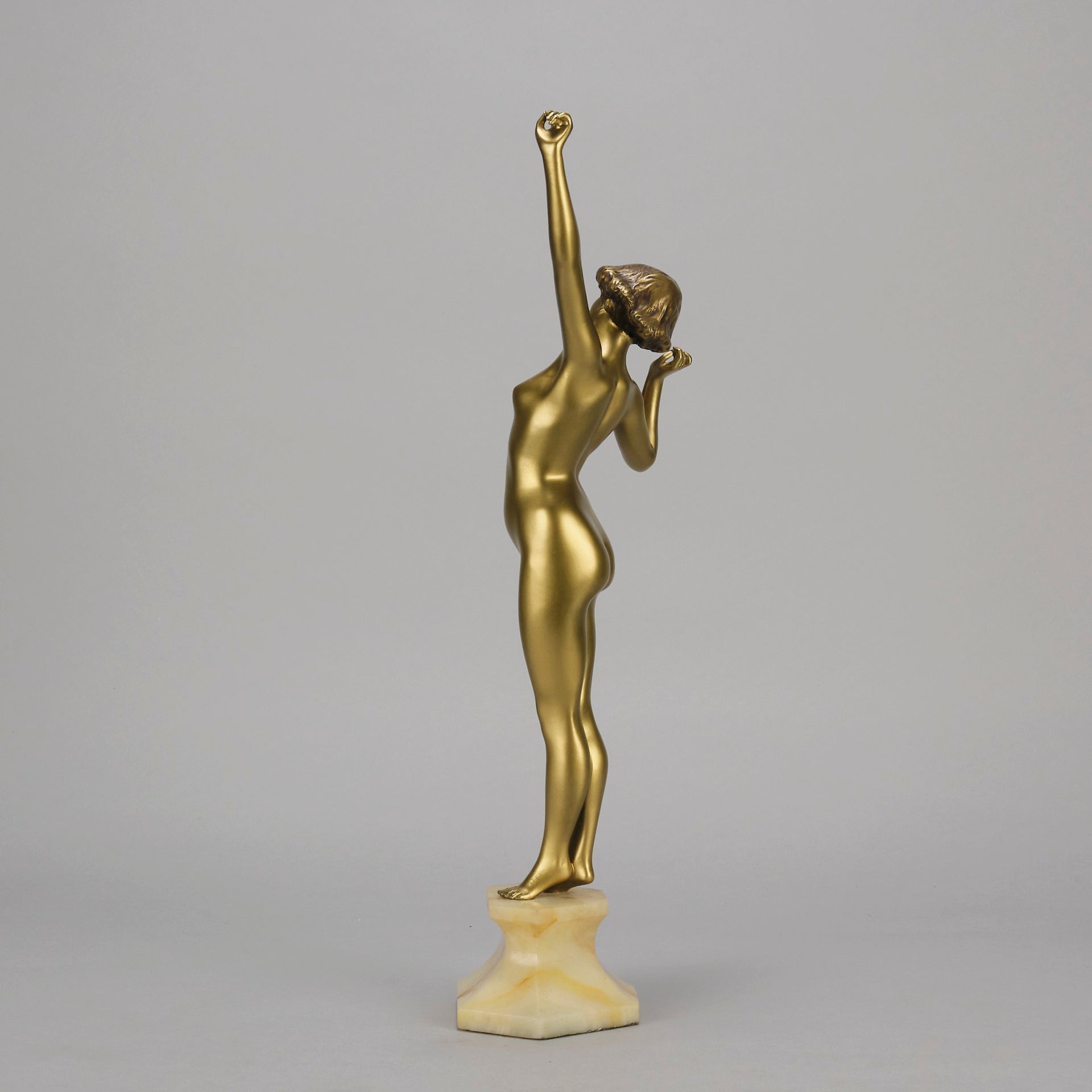 Art Deco Sculpture Le Reveil by Paul Philippe painted gilt and enamel bronze a attractive young woman as she stretches in the morning, raised on a shaped marble base