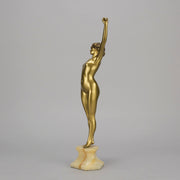 Art Deco Sculpture Le Reveil by Paul Philippe painted gilt and enamel bronze a attractive young woman as she stretches in the morning, raised on a shaped marble base