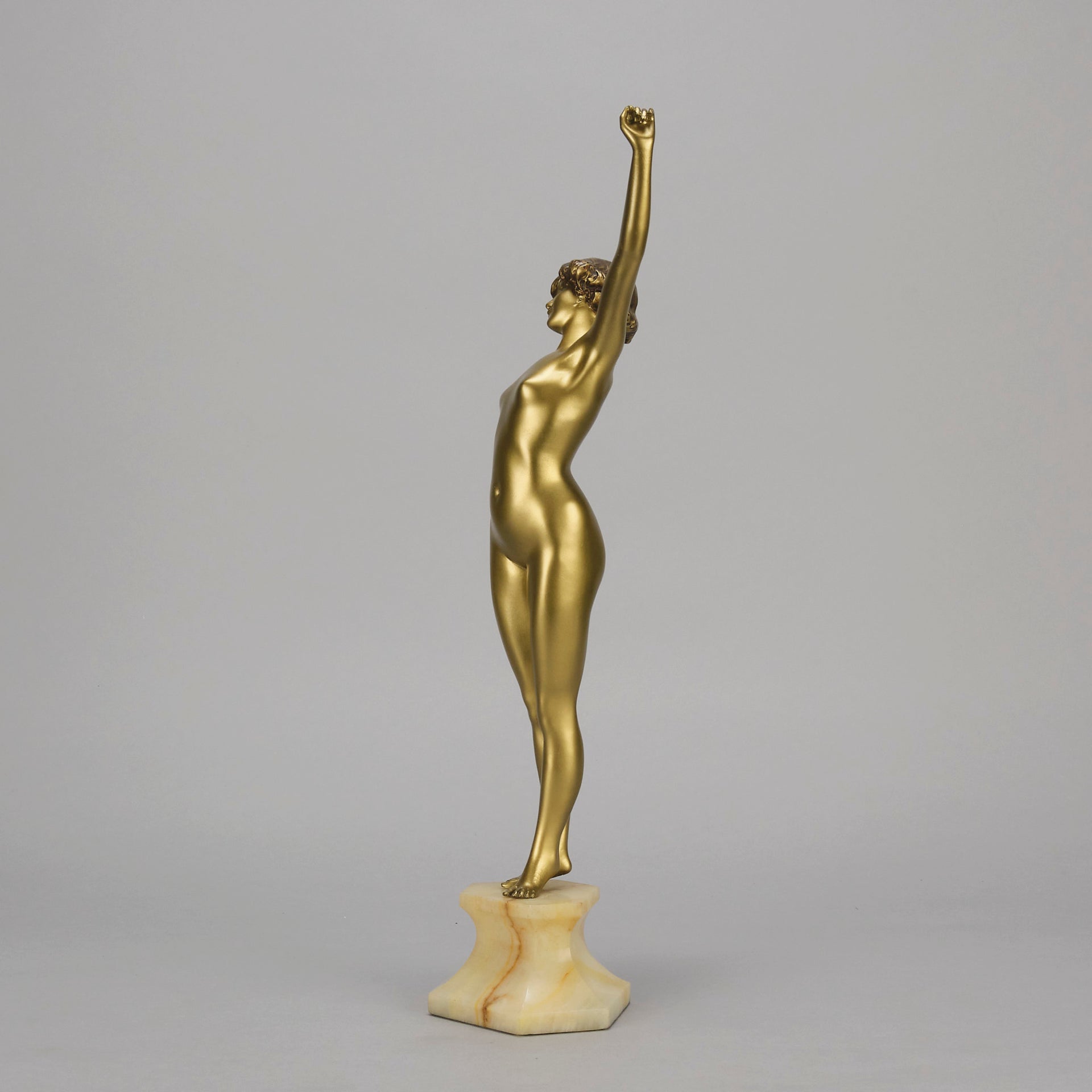 Art Deco Sculpture Le Reveil by Paul Philippe painted gilt and enamel bronze a attractive young woman as she stretches in the morning, raised on a shaped marble base