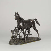 Djinn - Etalon Barbe by Antoine louis barye an antique bronze study of a stallion standing behind a post and rail fence