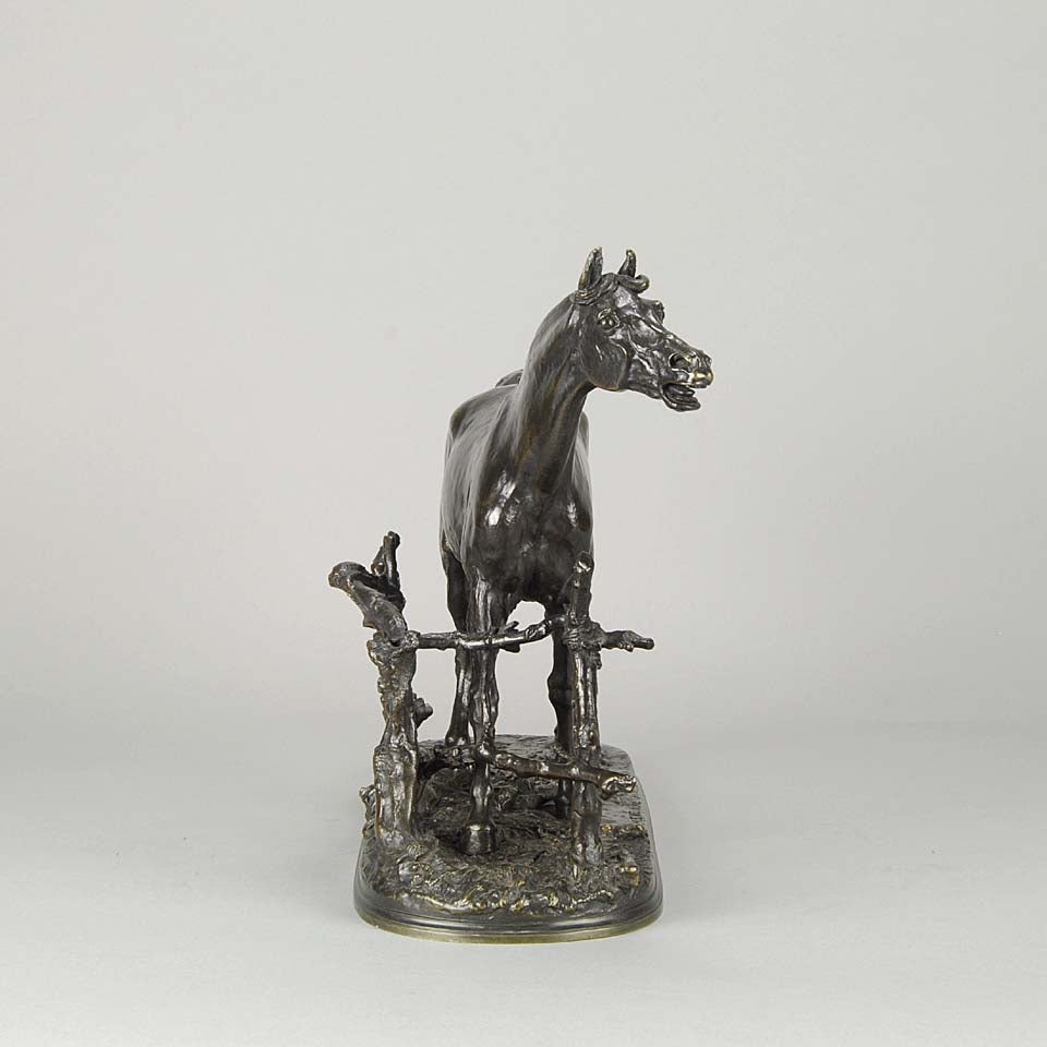 Djinn - Etalon Barbe by Antoine louis barye an antique bronze study of a stallion standing behind a post and rail fence