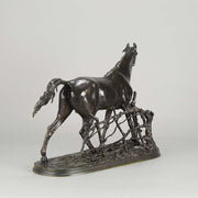 Djinn - Etalon Barbe by Antoine louis barye an antique bronze study of a stallion standing behind a post and rail fence