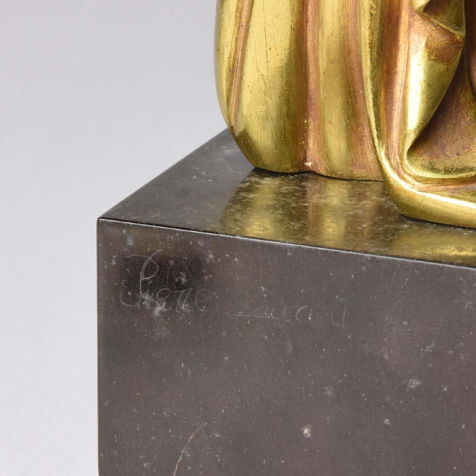 Femme avec Oiseau by Pierre Laurel an antique bronze figure of a semi clad young woman holding a bird in classic high Art Deco pose with excellent gilt patination and intricate surface detail on a square shaped black marble base 