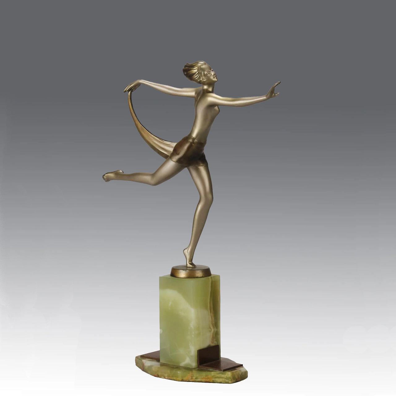 Dancer with Shawl by Josef Lorenzl art deco bronze figurine of a dancer holding an energetic pose wearing nothing but a shawl around her waist. The bronze exhibiting excellent colour and very fine hand chased surface detail, raised on a green onyx base