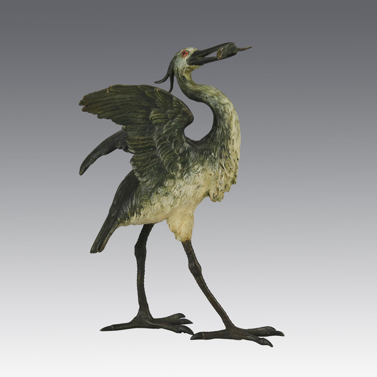 A Standing Stork with Fish Antique Bronze Statue by Franz Bergman exhibiting very fine cold painted colours and good hand finished surface detail