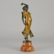 Flamenco Dancer by T Curts a charming Art Nouveau bronze figure of a flamboyant flamenco dancer holding a striking pose, her diaphonous gilded dress seductively draped over her, pinned and hinged to be removed in order to reveal her beautiful naked body